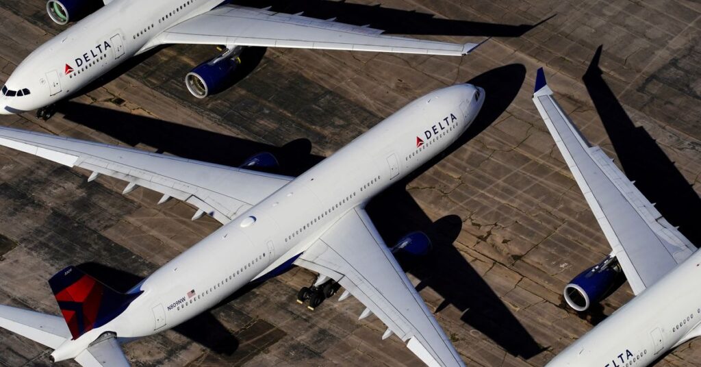 Delta Air Lines to add $200 monthly health insurance charge for unvaccinated staff | Reuters